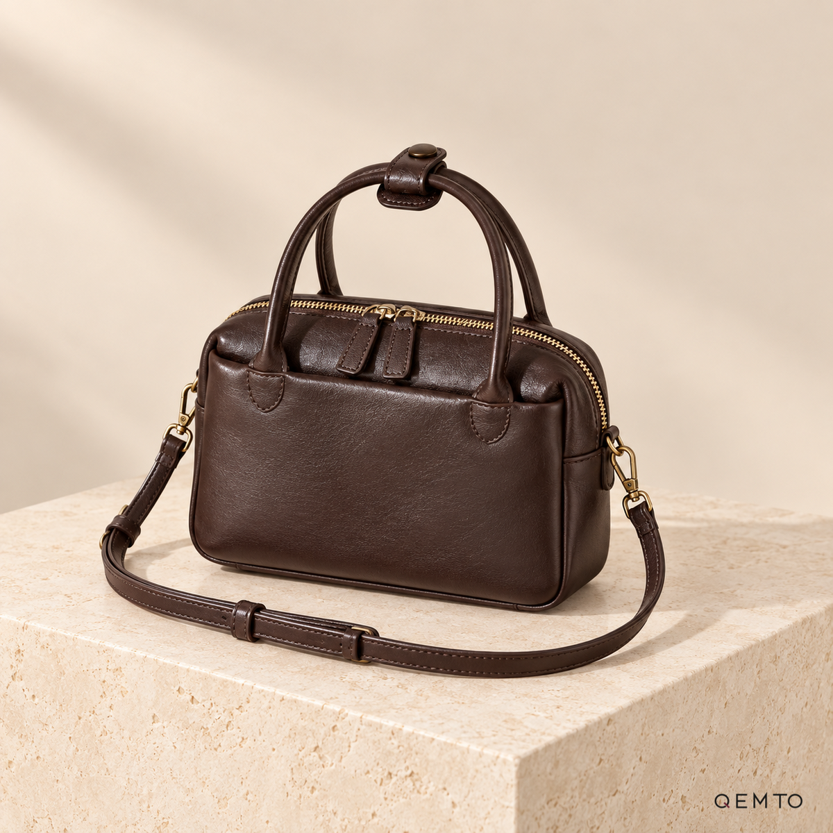 QEMTO Talia Boston Bag in Coffee full-grain cowhide leather, studio shot
