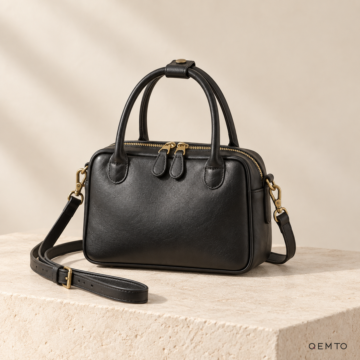 QEMTO Talia Boston Bag in Black full-grain cowhide leather, studio shot