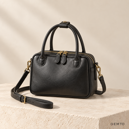 QEMTO Talia Boston Bag in Black full-grain cowhide leather, studio shot