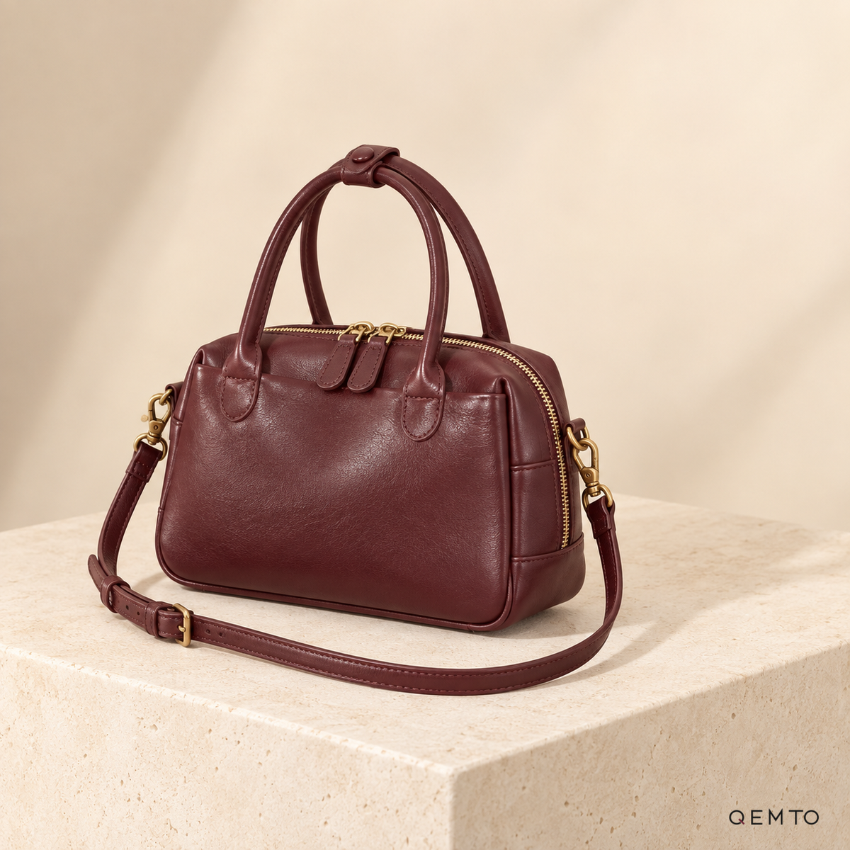 QEMTO Talia Boston Bag in Burgundy full-grain cowhide leather, studio shot