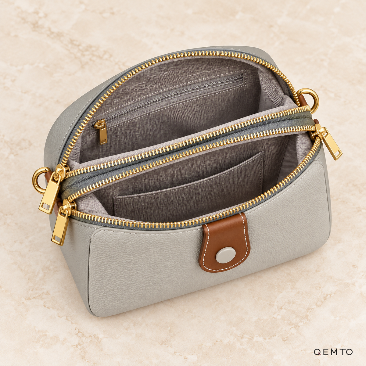 Interior of the QEMTO Ivy Camera Bag, showing zippered compartments and pockets