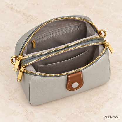 Interior of the QEMTO Ivy Camera Bag, showing zippered compartments and pockets