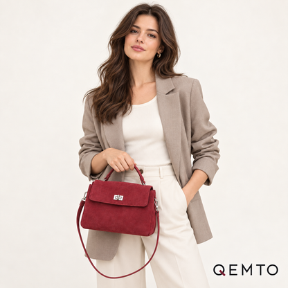 QEMTO Vera Top-Handle Bag in red suede worn by a model with top handle