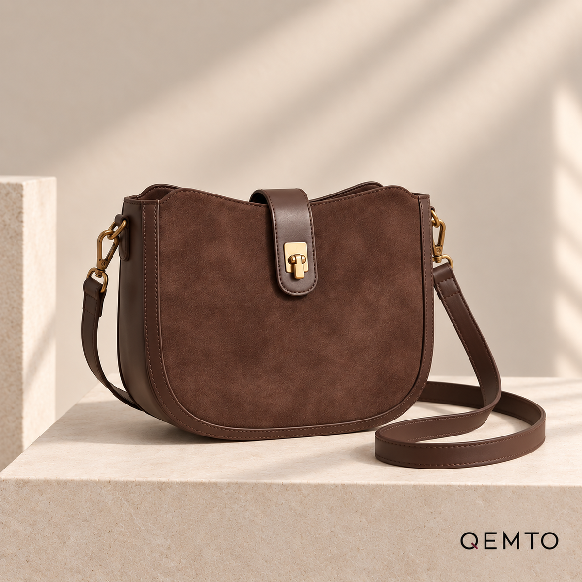QEMTO Mara Saddle Bag in Coffee — front product view