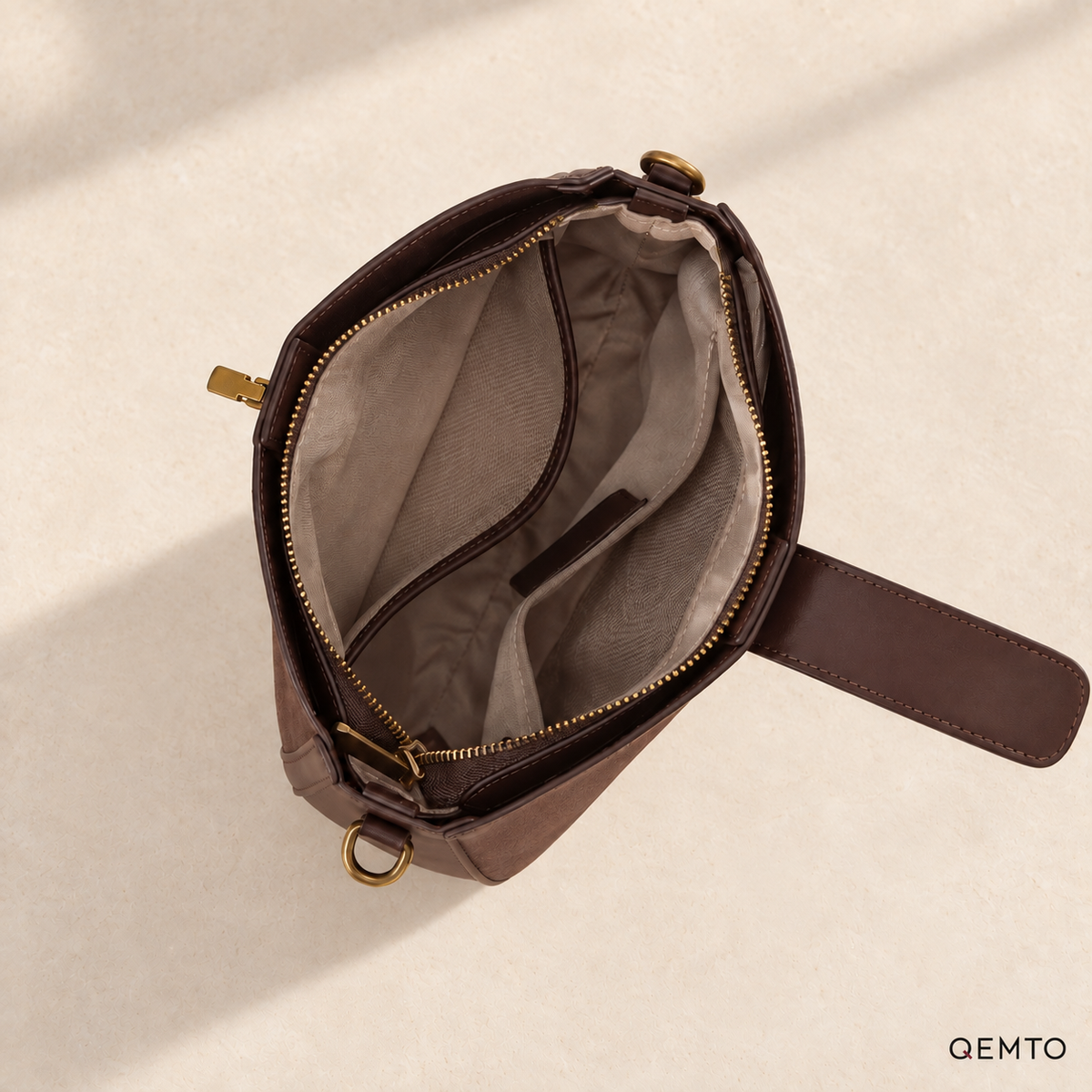 QEMTO Mara Saddle Bag — zip-top interior and pockets